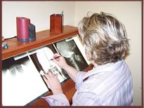 Dr. Christensen Studies X-Rays for a Precise Realignment of the Spine